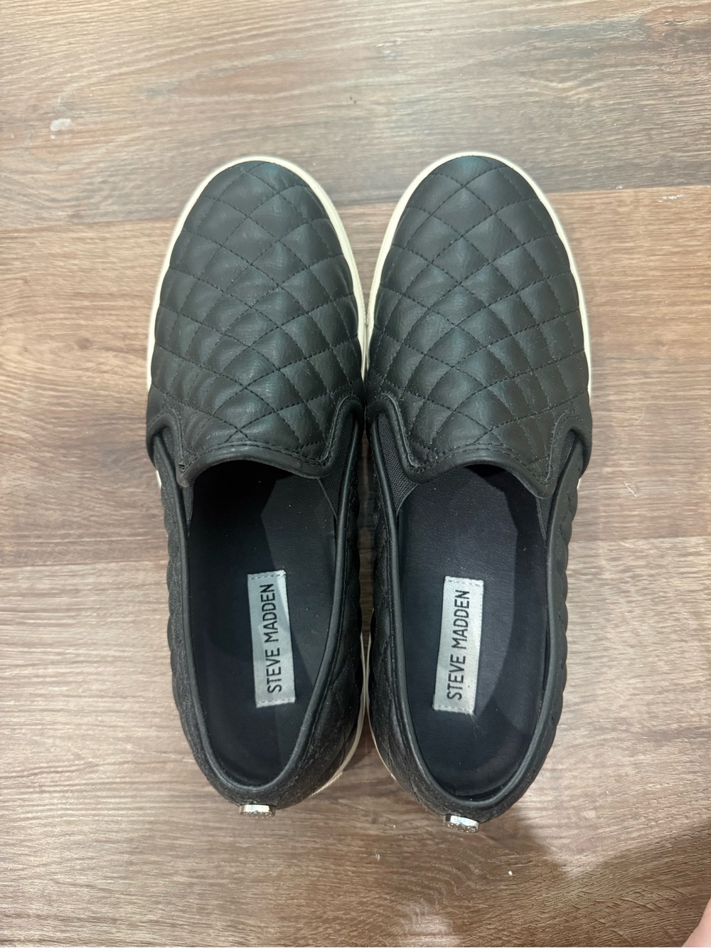 Steve Madden women’s Black Quilted Slip-On Sneakers